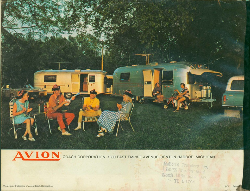 travelcaders around the fire with hats